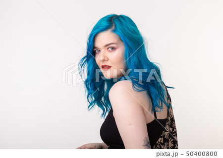 people, fashion and hair concept - beautiful girl with blue hair standing on white background 50400800