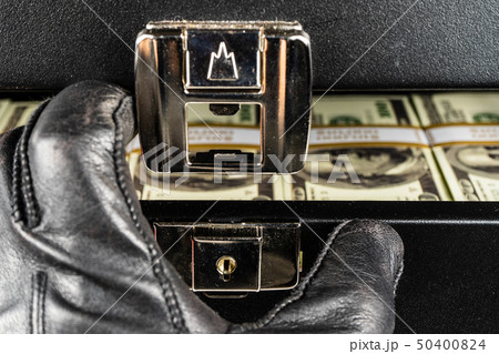 Black case full of dollar bills close up.Money 50400824