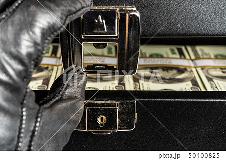 Black case full of dollar bills close up.Money Black case full of dollar bills close up.Money 50400825