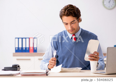 Young handsome employee working in the office  50406025