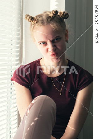 girl making grimace girl making grimace 50407994