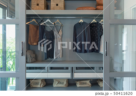 modern closet with clothes hanging modern closet with clothes hanging 50411620