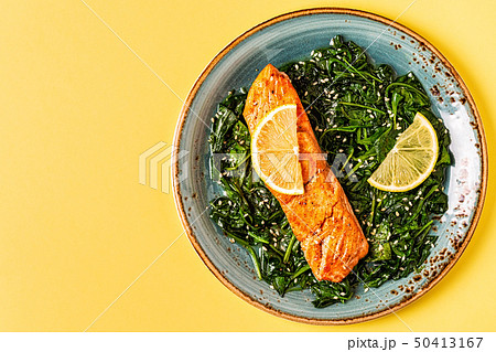 Grilled salmon with spinach. Grilled salmon with spinach. 50413167