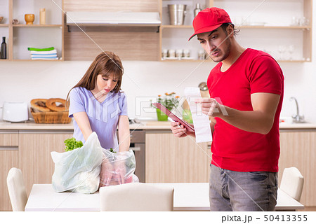 Young male courier in food delivery concept Young male courier in food delivery concept 50413355