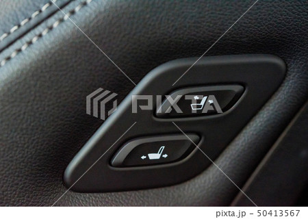 Close up shot of modern car central console with seat controls 50413567