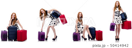 Beautiful woman in polka dot dress with suitcases isolated on wh Beautiful woman in polka dot dress with suitcases isolated on wh 50414942