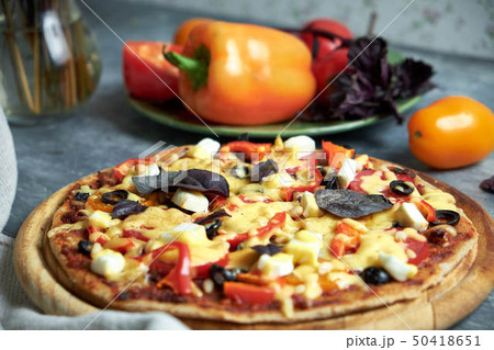 Slice of hot pizza large cheese lunch or dinner crust seafood meat topping sauce. with bell pepper Slice of hot pizza large cheese lunch or dinner crust seafood meat topping sauce. with bell pepper 50418651