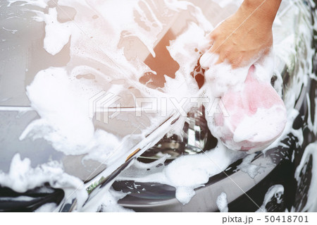 The man hand with pink sponge clean washing car  50418701