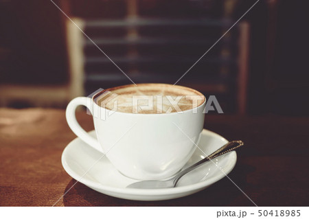 Hands of man holding entwine cup of coffee Hands of man holding entwine cup of coffee 50418985
