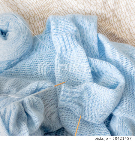 Cardigan from blue wool with the process of mating 50421457