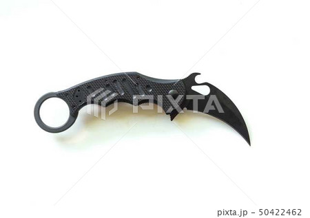 Claw-shaped knife. Animal claw on white backgroun. Claw-shaped knife. Animal claw on white backgroun. 50422462