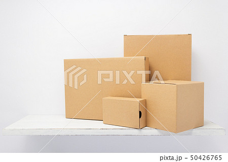 cardboard box on wooden shelf 50426765