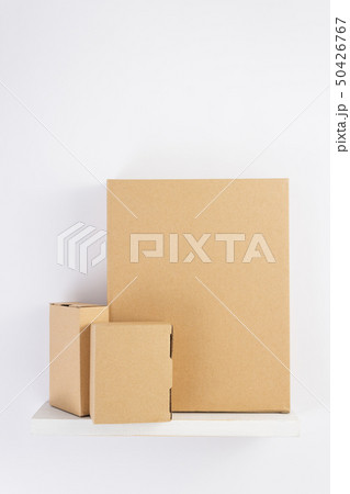 cardboard box on wooden shelf cardboard box on wooden shelf 50426767