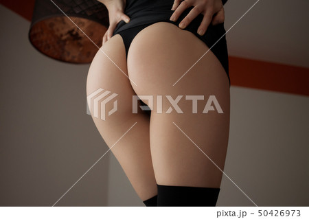 Ass of sensual woman in lingerie in room 50426973
