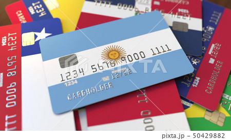 Many credit cards with different flags, emphasized bank card with flag of Argentina. 3D rendering 50429882
