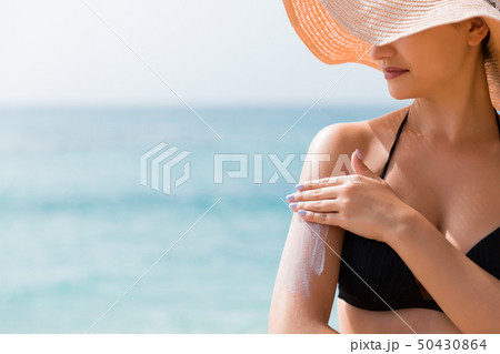 Beautiful lady is sunbathing on the beach Beautiful lady is sunbathing on the beach 50430864
