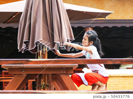 Asian girl raise an umbrella, Students or Children Asian girl raise an umbrella, Students or Children 50433776