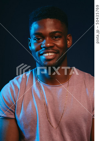 African excited young man smiling, having fun at camera. Positive human emotion. African excited young man smiling, having fun at camera. Positive human emotion. 50435769