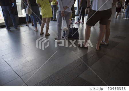 People waiting in line queue People waiting in line queue 50436358