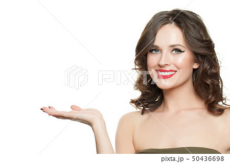 Happy beautiful woman holding empty open hand 50436698