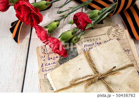 Military letter, old photos, carnations and Military letter, old photos, carnations and 50436762