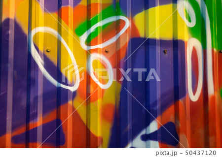 Unfocused abstract pattern on an iron fence 50437120