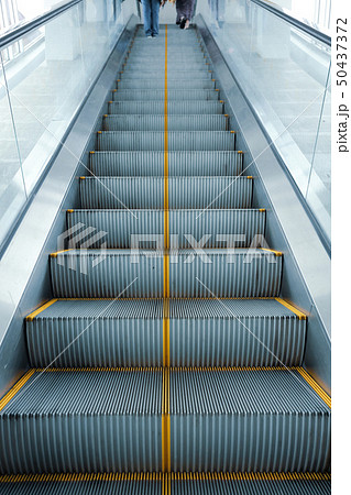 escalator in modern business building 50437372