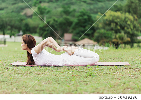 woman practice yoga Frog pose or Bhekasana pose 50439236