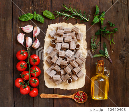 Whole wheat pasta, vegetables,  herbs and olive 50440408