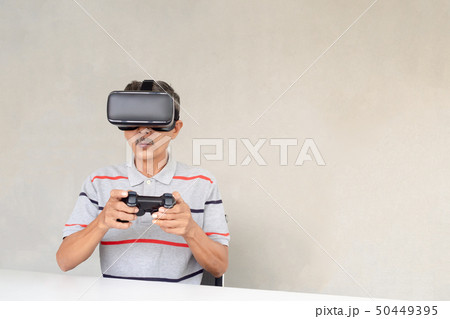 Asian Elderly men are enjoying vr technology 50449395