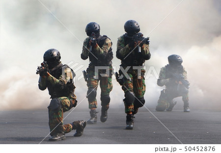 Special force assault team under smoke screen 50452876