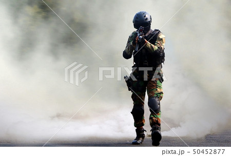 Special force assault under smoke screen 50452877