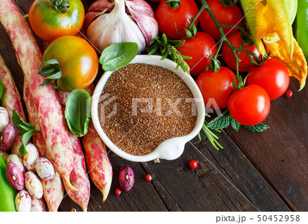Uncooked teff grain with vegetables Uncooked teff grain with vegetables 50452958