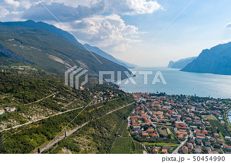 Aerial view on Nago Torbole city and Sarca River. 50454990