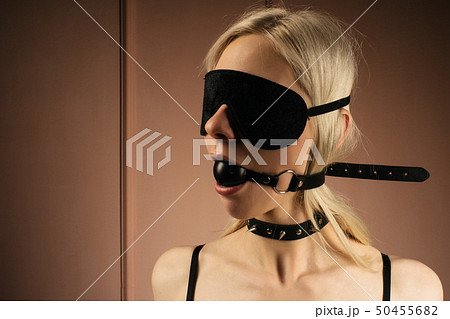 Sexy lady in bdsm outfit. Close-up girl in mask 50455682