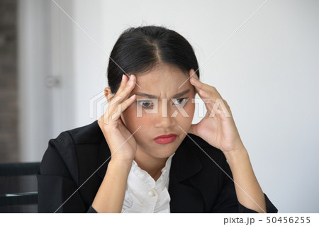 Portrait of frustrated young woman holding hand on Portrait of frustrated young woman holding hand on 50456255