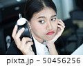Asian business woman feeling tired and bored 50456256