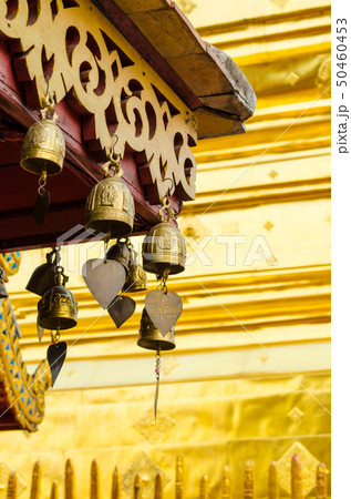 metal bells hanging on roof 50460453
