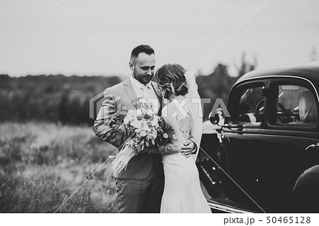 Caucasian happy romantic young couple celebrating their marriage. Outdoor Caucasian happy romantic young couple celebrating their marriage. Outdoor 50465128