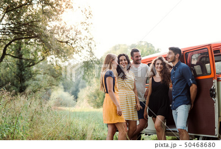 A group of young friends on a roadtrip through countryside. 50468680