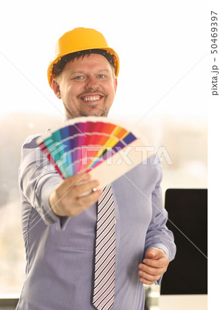 Graphic Designer Work on Project with Color Chart 50469397