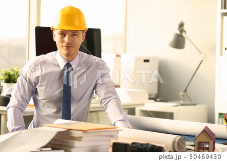 Confident Civil Engineer Working on House Sketch 50469430