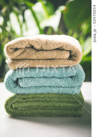 Towels on tropical leaves background, close up 50470054