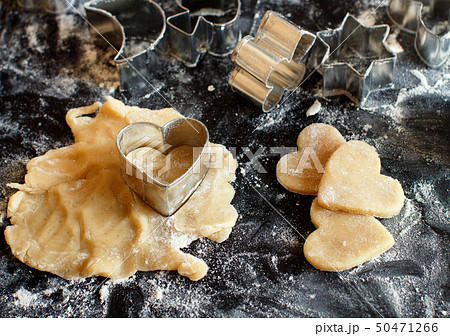 Close up of cookie cutters in a dough 50471266