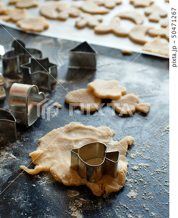 Close up of cookie cutters in a dough Close up of cookie cutters in a dough 50471267