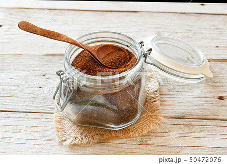 Uncooked  teff grain in a glass jar 50472076
