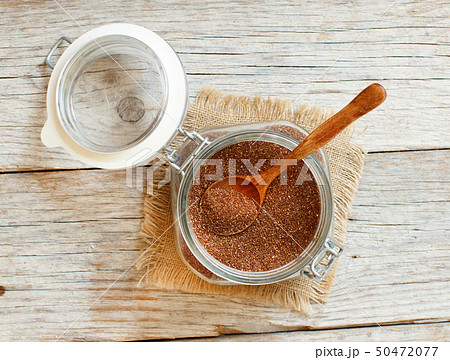 Uncooked  teff grain in a glass jar 50472077