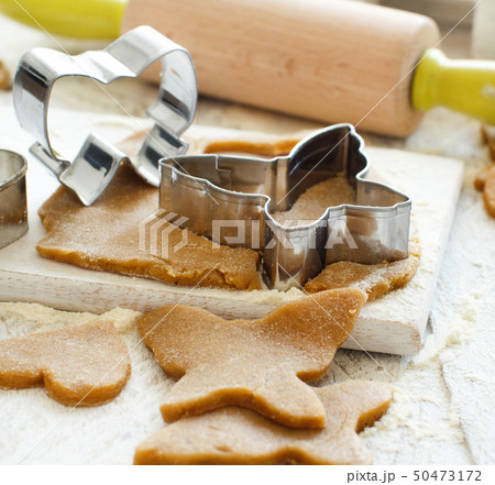 Cooking cookies with  cookie cutters 50473172
