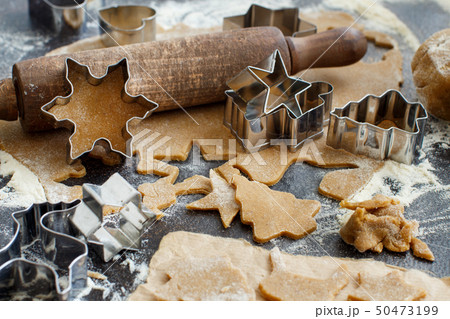 Cooking Christmas cookies with  cookie cutters 50473199