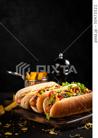 Three delicious hotdogs 50473521